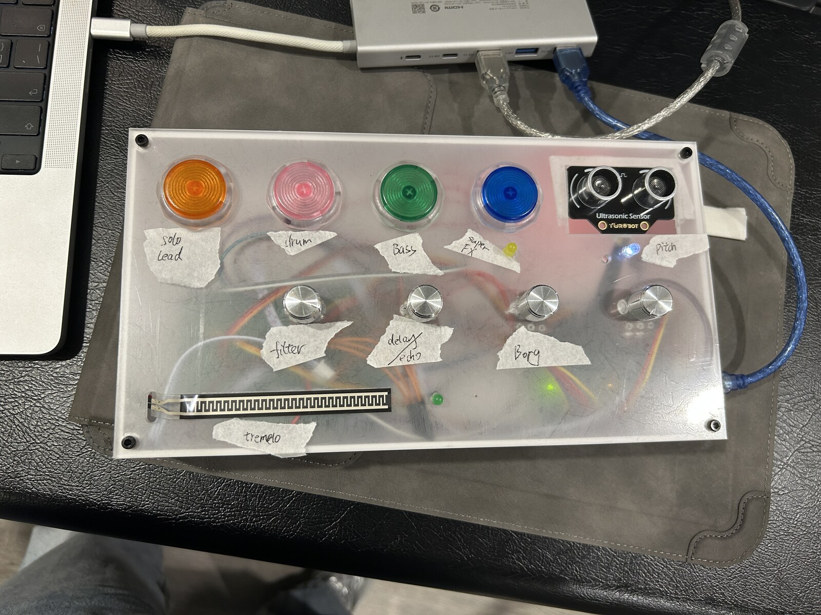 The controller with small hand-written paper labels beside the buttons and knobs from an earlier mapping session.
