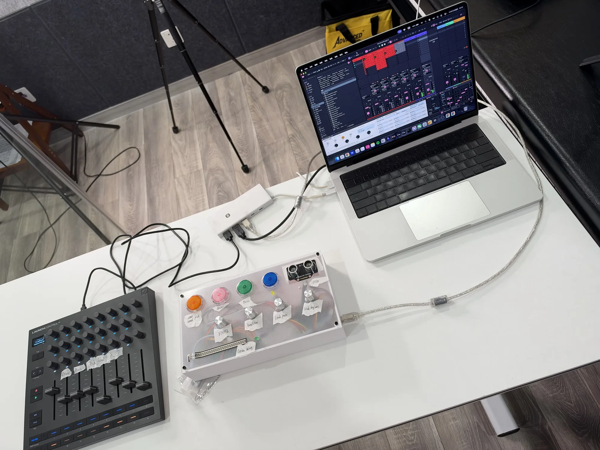 Performance setup with the custom controller, Launch Control XL, laptop running Ableton Live, and a camera tripod.